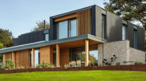 Modern Buckinghamshire new build with Internorm alu-clad windows and vertical timber cladding, designed with clean lines and natural materials.