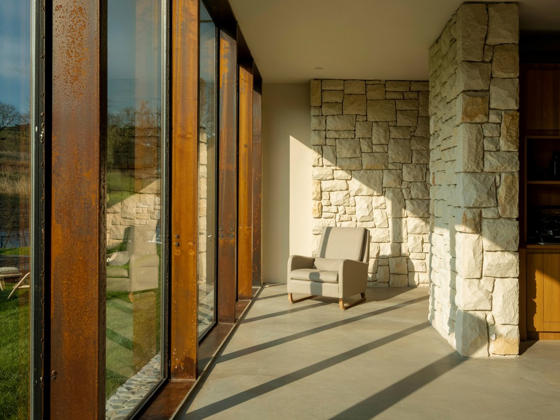 in this architectural portrait, triple glazed Corten steel windows form a razor-thin edge between interior and exterior